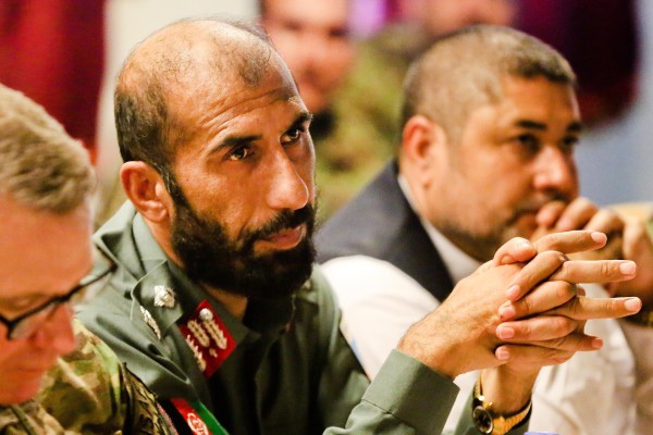 (Left-right) Maj. Gen. Paul J. LaCamera, commanding general, 4th Infantry Division, Commander Regional Command (South), Brig. Gen. Matiullah Khan, provincial chief of police, and the provincial commander National Directorate of Security Khan Mohammad Khan sit during the base closure committee meeting at Multinational Base - Tarin Kot, Aug. 21.